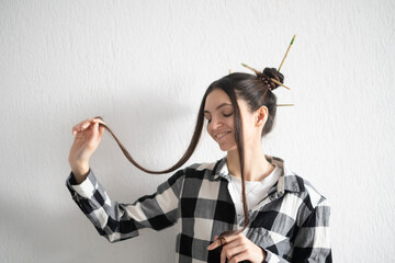 Smiling Young Girl Taking with stylish dark hairstyle, enjoy life