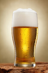 Beer. Glass of fresh and cold beer with drops. Selective focus