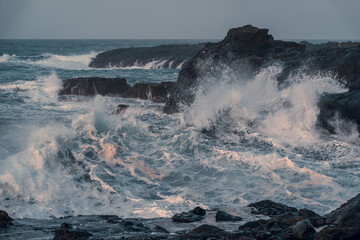 waves beating against the rocks in El Puertillo at sunset. Arucas. Gran Canaria. Canary islands