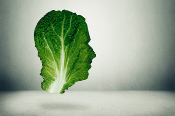 healthy diet concept. Green lettuce leaf shaped as a human head 