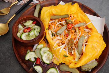 Vietnamese Savory Crepe and fresh cucumbers, sweet sauce, street food