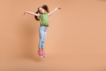 Photo of graceful girl kid jump dance move pose isolated pastel color background