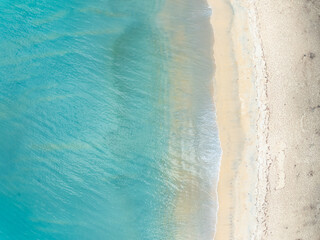 Amazing Top view sea beach landscape background,Summer sea waves crashing on sandy shore seascape...