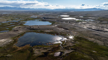 landscape of the surroundings of the village of Kosh Agach mountains with lakes and unusual landscapes from the height of a drone flight in the southern regions of Altai in May