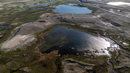 landscape of the surroundings of the village of Kosh Agach mountains with lakes and unusual landscapes from the height of a drone flight in the southern regions of Altai in May