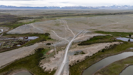landscape of mountains, lakes and an unusual bend of rivers from the height of a drone flight in the southern regions of Altai in May