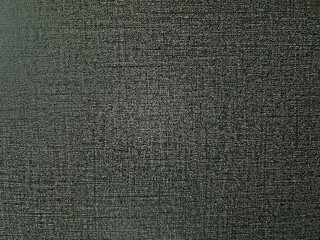 Detailed Close-Up of Dark Textured Fabric with Fine Weave Pattern and Subtle Surface Variations