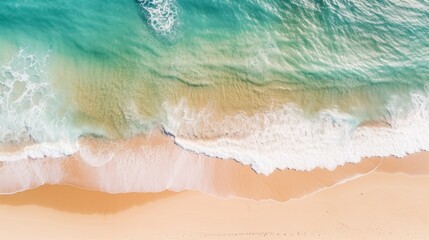 Aerial view of beautiful sea waves Pink sand and emerald green waters Amazing waves crashing on the sandy beach.