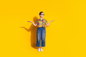 Obraz premium Photo of pretty nice senior woman wear stylish clothes hold look empty space isolated on yellow color background