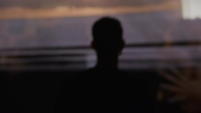 Back view of man standing in a dark environment Life Flashing in front of his eyes religious experiences