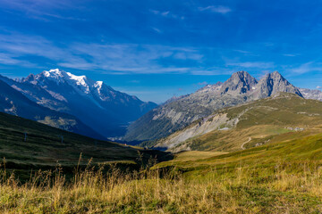 Chamonix Montblanc beautiful alpine mountain summits landscape. Alps mountains with snow and glacier above green valley of Chamonix in France. Alps beautiful scenery in summer