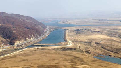 Tiger Mountain Great Wall, UNESCO World Heritage Site, near Dandong, Liaoning Province, China, panoramic elevated view of the Yalu River that separates China (left) from North Korea (right)