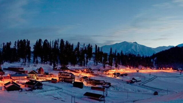 Gulmarg ski resort, India, Jammu and Kashmir, panoramic night view of mountains and village under snow, altitude 2700 meters