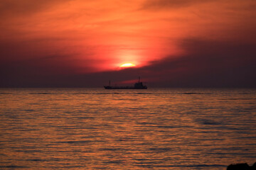 View of the sunset over the ship and horizon