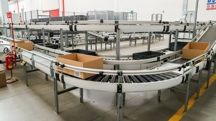 packing line in a logistics warehouse. industrial conveyor belt. 