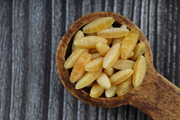 Raw fresh and healthy dry organic barley noodle on wooden spoon