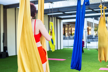 Exercises for body flexibility suspended fabric, aerial yoga.