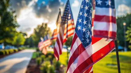 a row of American flags displayed prominently, fluttering in the wind. The scene evokes a sense of patriotism and pride, with the vibrant red, white, and blue colors standing out against the sky.