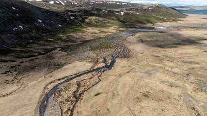 stunning landscapes of mountains, lakes and rivers from a drone flight in the southern regions of...