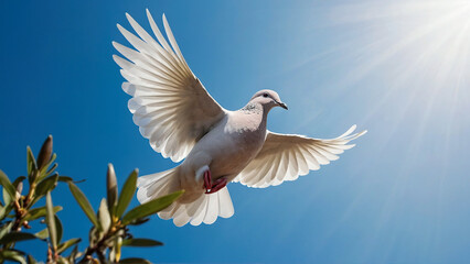 Obraz premium White dove in flight against the blue sky. Symbol of peace, goodness and purity
