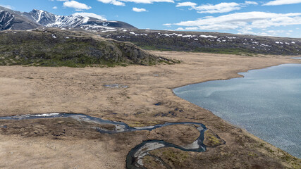 stunning landscapes of mountains, lakes and rivers from a drone flight in the southern regions of Altai in May