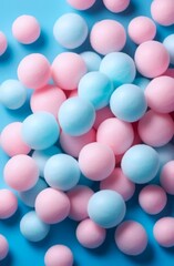 fluffy soft blue and pink balls against blue background, cotton candy balls, cotton pom poms. concepts: sweets, softness, comfort, playful atmospheres, marketing materials, web design textures.