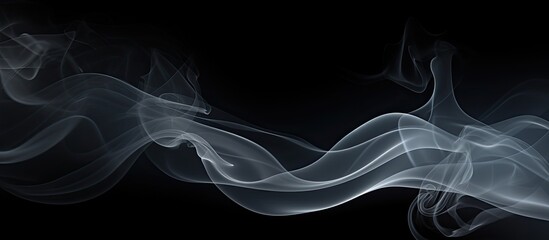 Copy space image of smoke patterns against a black backdrop