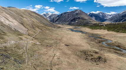 stunning landscapes of mountains, lakes and rivers from a drone flight in the southern regions of Altai in May