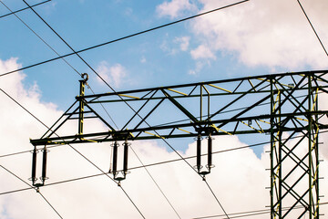 Power generation, transmission and distribution concept. Close-up of a electricity supply pylon and...