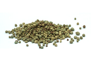 Organic-chemical fertilizer pellets on a white background