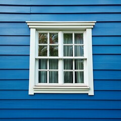Fototapeta premium Blue vinyl siding texture and window, close-up view.