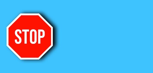Red stop sign on a blue background. Stop, warning background with coy space for text,notice, message, safety information concept. 