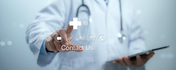 Medical worker with virtual screen contact icons email, address, live chat, internet wifi. Contact...