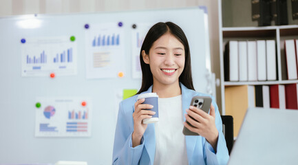 Happy young woman uses laptop computer for virtual meeting Have a video call at home Cheerful Asian...