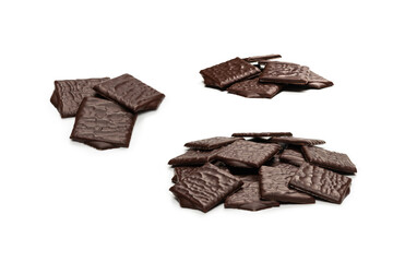Dark chocolate candies isolated on white background.