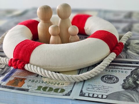 Life Preserver on Pile of Money