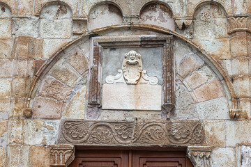 Lunette above the portal of Madonna delle Grazie sanctuary in Iglesias. Sardinia, Italy