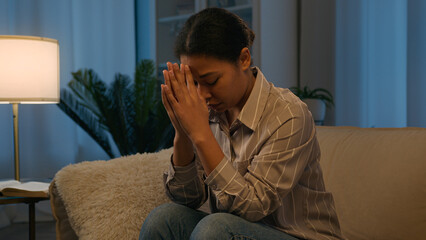 Worried sorrowful upset African American woman ethnic girl suffering stress praying anxiety...