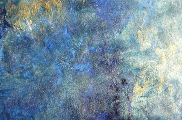 
dirty art background of stains in dark blue with gold
