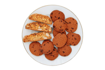 Biscotti and chocolate chip cookies on a plate isolated on a white background. View from above.