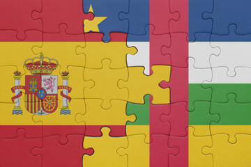 puzzle with the colourful national flag of central african republic and flag of spain.