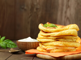 fried thin flatbreads with sauce on the table