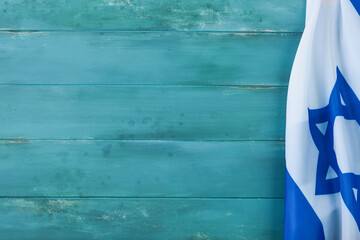 Shavuot jewish background. Ripe bouquet of wheat with blue ribbon with Israel flag and backgrounds....