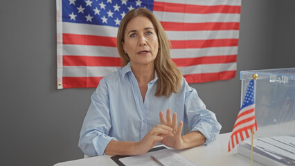 Mature caucasian woman in a blue shirt discussing important topics in an american electoral setting...