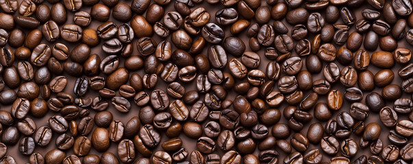 Obraz premium Close-up of roasted coffee beans in varying shades of brown.