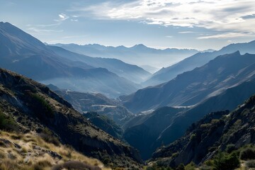 Naklejka premium Majestic Mountain Range with Picturesque Valley Landscape