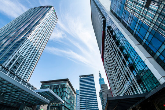 Taipei, Taiwan- May 4, 2020: Low-angle view of modern buildings in Xinyi District, Taipei, Taiwan. the district is Taipei's main shopping area, anchored by several department stores and malls.