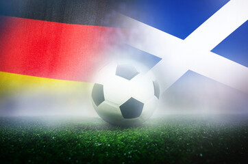 group A stage match , Germany vs Scotland , Football Nation Flag and soccer ball on green grass