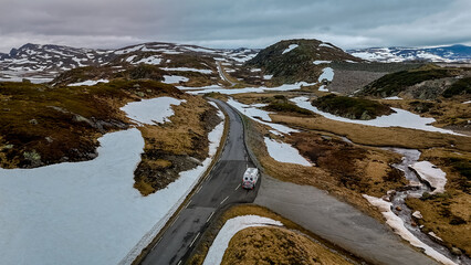 Campervan Caravan trailer, or camper RV at the Lyse road covered with snow to Krejag Norway Lysebotn, road covered with snow, road trip in Norway