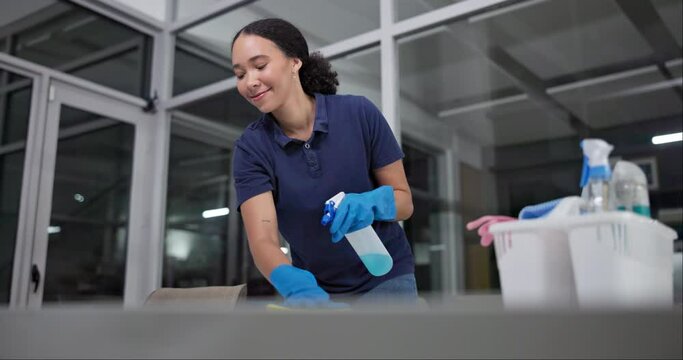 Woman, wipe and spray for cleaning in office, disinfection and janitor for liquid soap. Female person, maintenance service and chemical treatment to prevent germs, bacteria and disease at night